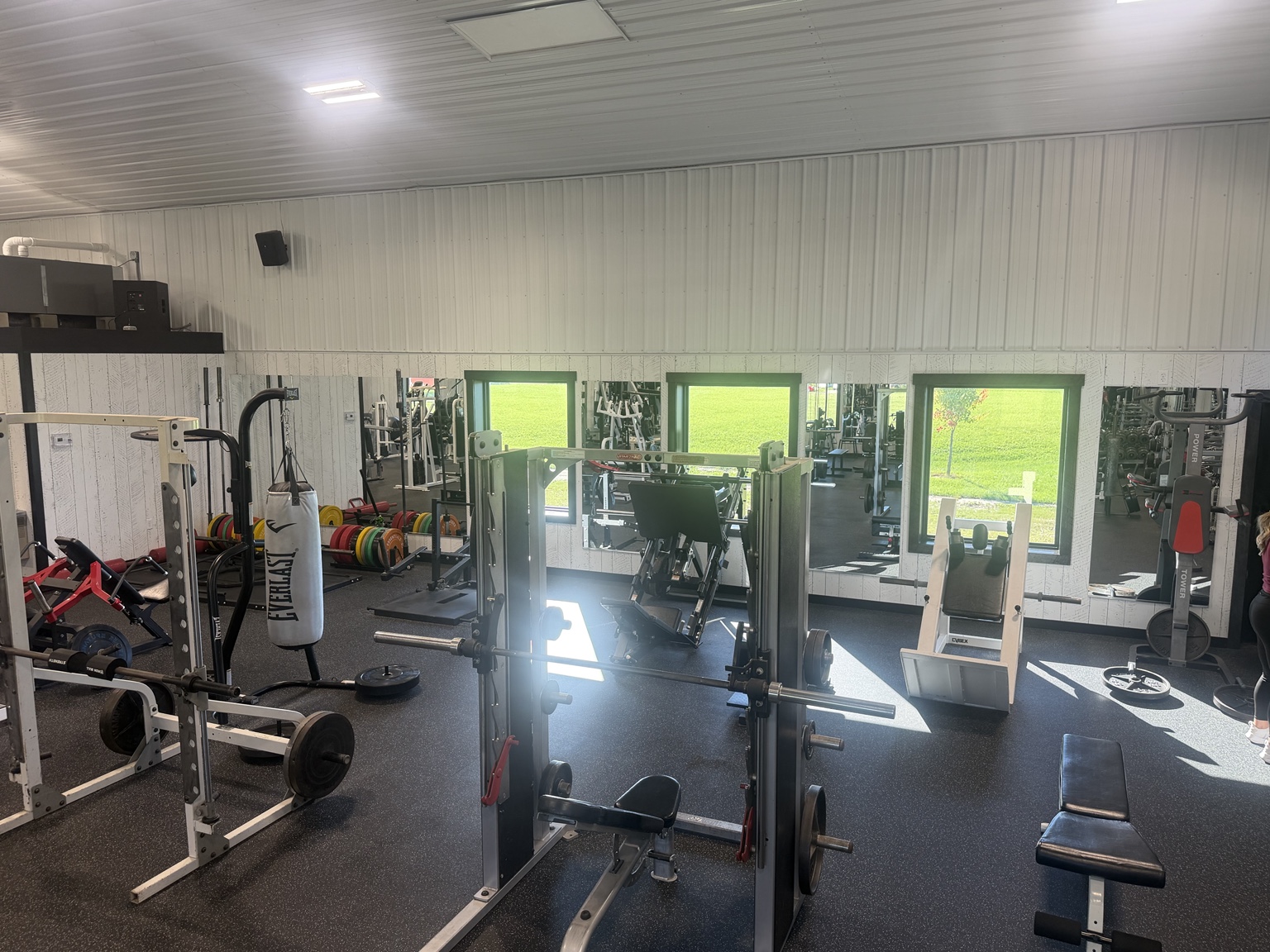 Sunlit gym with strength equipment